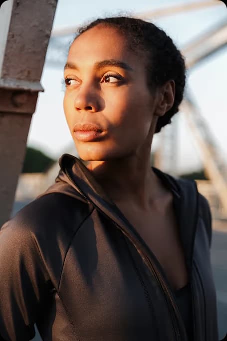 woman looking off camera into the light