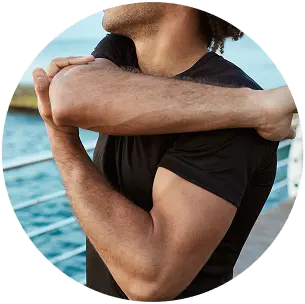 man stretching after Adhesive Capsulitis Embolization