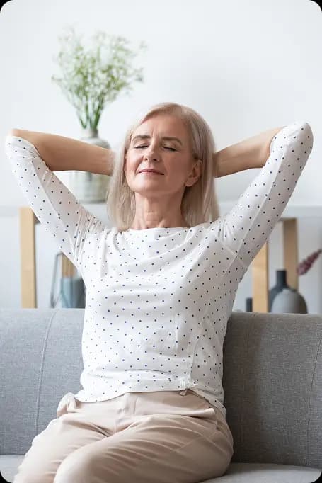 older woman stretching from relief