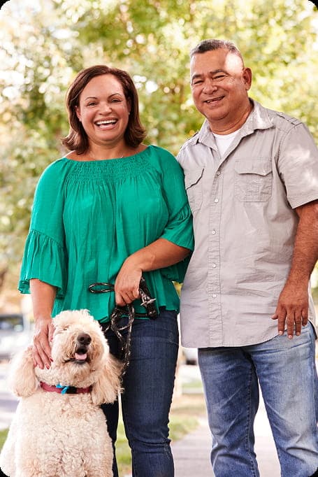 couple smiling with dog