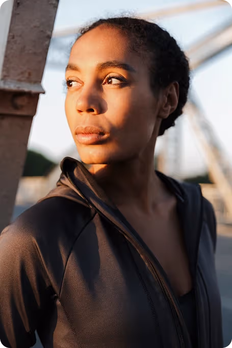 woman looking off camera into the light