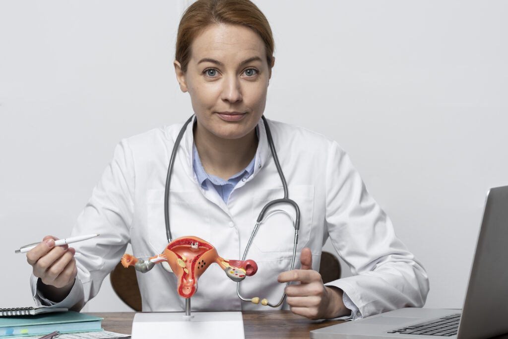 The current image has no alternative text. The file name is: medium-shot-doctor-with-anatomic-model-1-scaled.jpg