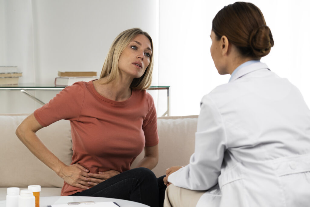The current image has no alternative text. The file name is: side-view-doctor-talking-woman-2-scaled.jpg